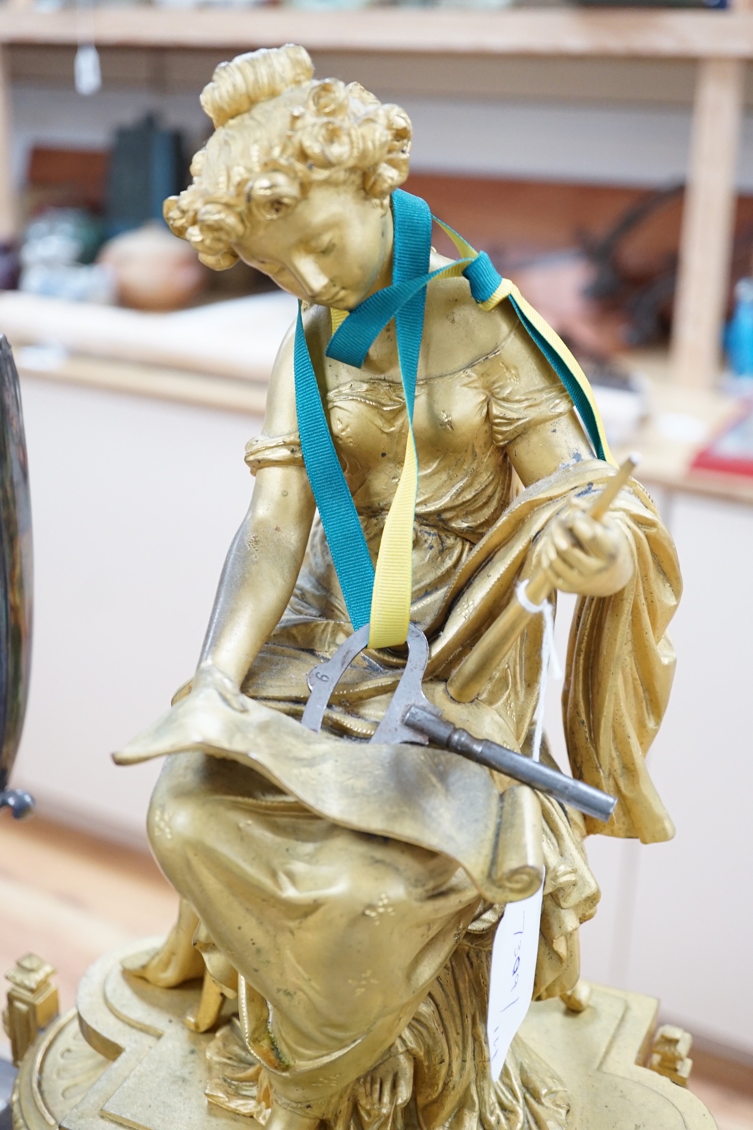 A French gilt metal figural mantel clock, 48cms high